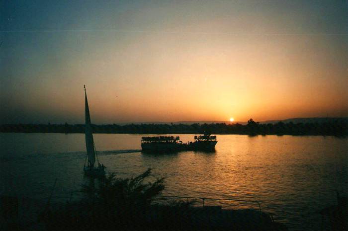 Falucca and a ferry crossing the Nile from Luxor to the Valley of the Kings.