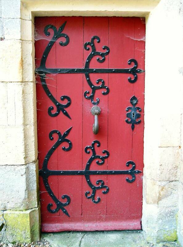 Red armored door at Château de Chevenon, south of Nevers near the Canal Latéral à la Loire.