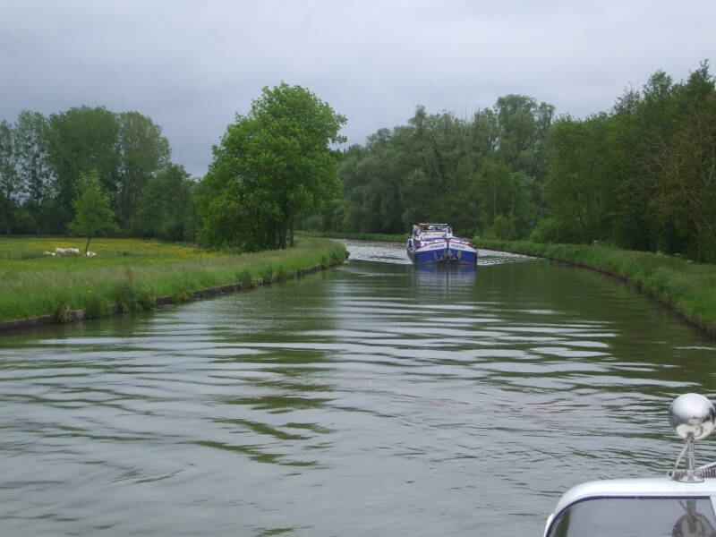 Passing a commercial barge on the Canal Latéral à la Loire.