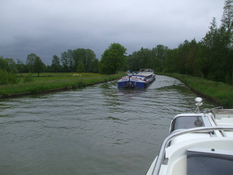 Passing a commercial barge on the Canal Latéral à la Loire.