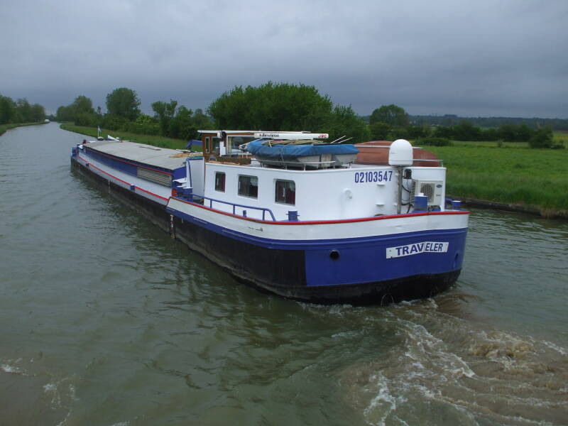 Passing a commercial barge on the Canal Latéral à la Loire.