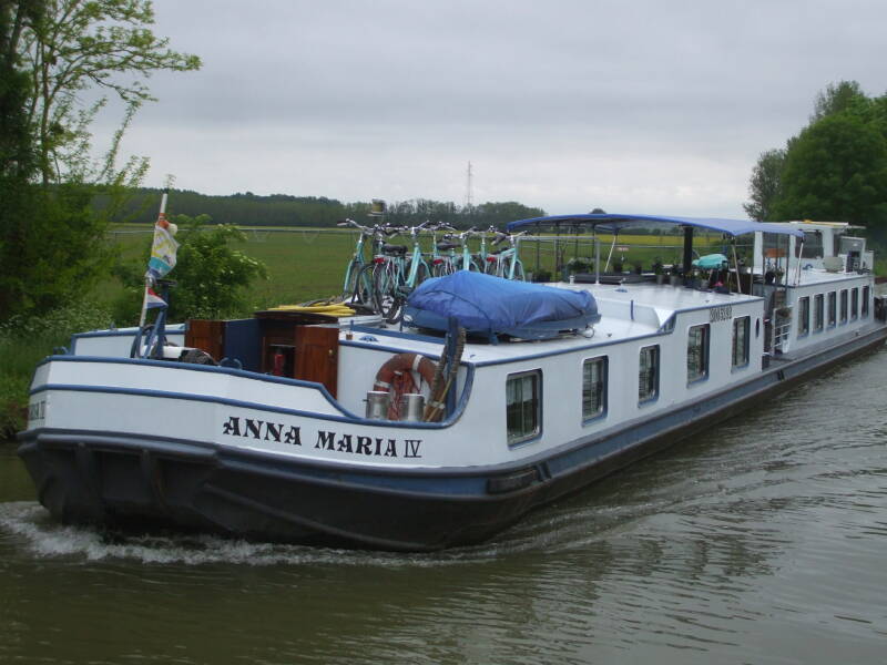 Passing a commercial barge on the Canal Latéral à la Loire.