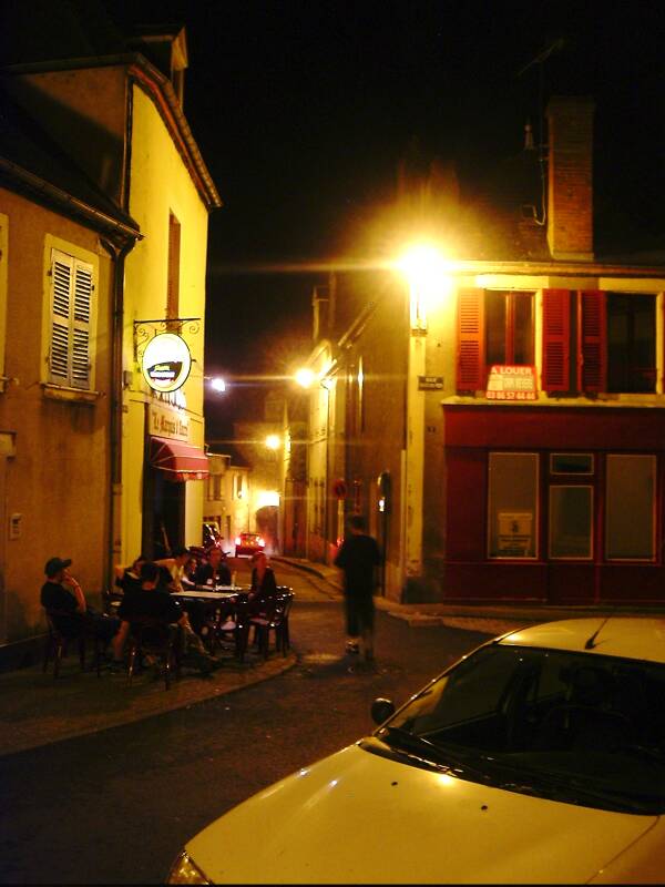 That same cafe at night in the old city in Decize.