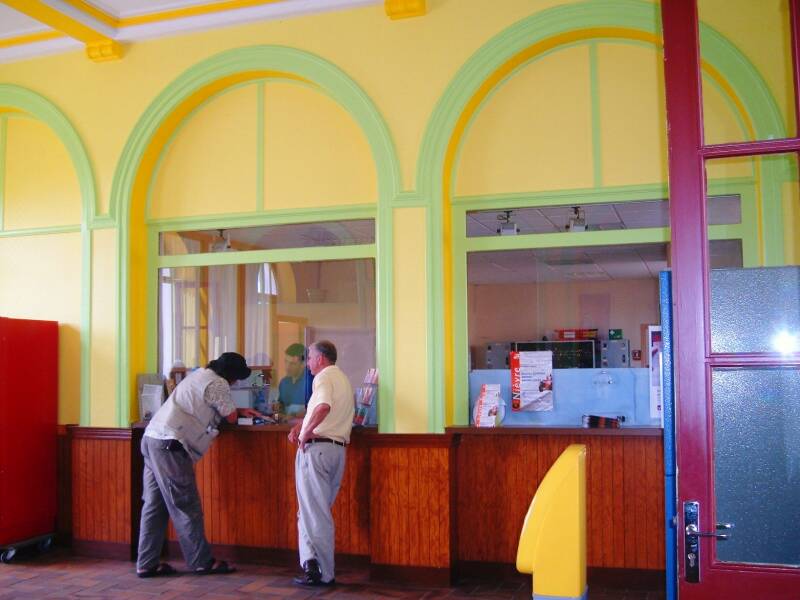 Buying RER regional train tickets in the station in Decize.