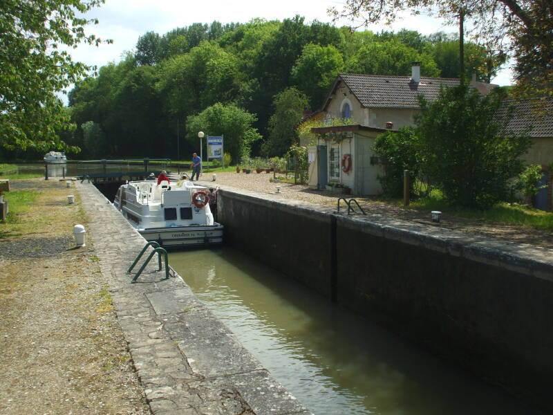 Cycling the canal lock at Peseau.