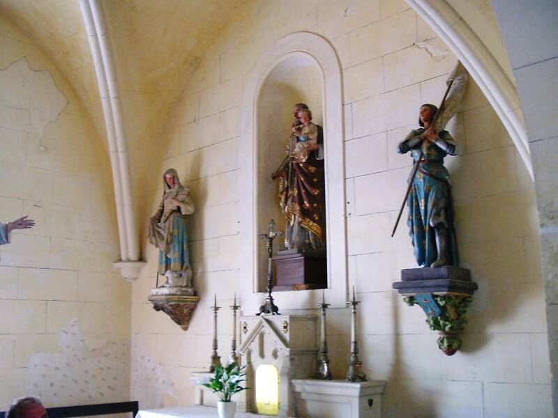 Statue of Jean of Arc inside the church at the center of the small village of Saint-Bouize.