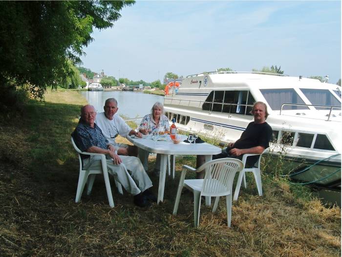 A break for wine and cheese on the canal bank.