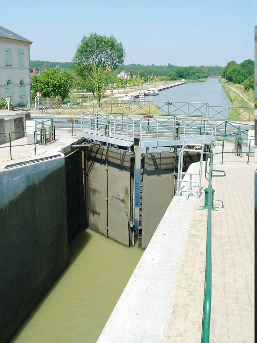 Tall gates on a canal lock with higher rise.