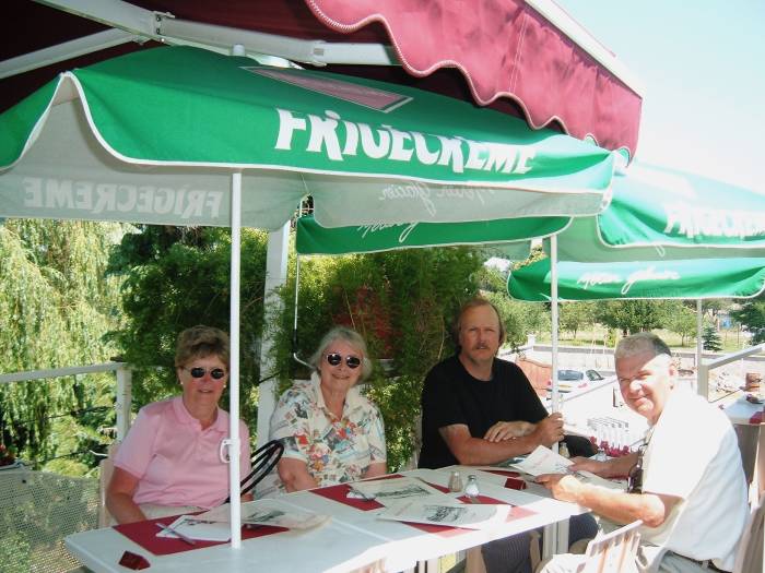 Shaded restaurant patio in central France.