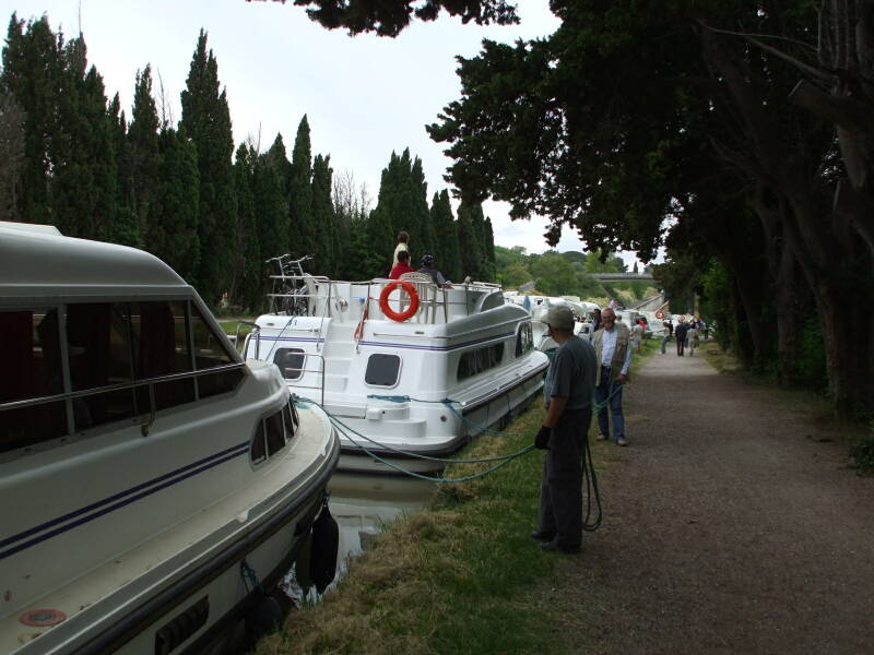 Boats queued for passage through the 7-lock flight of Fonserannes on the Canal du Midi.