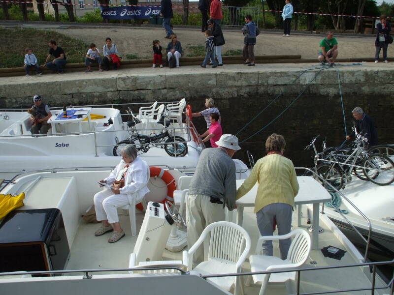 Boats passing through the 7-lock flight of Fonserannes on the Canal du Midi.