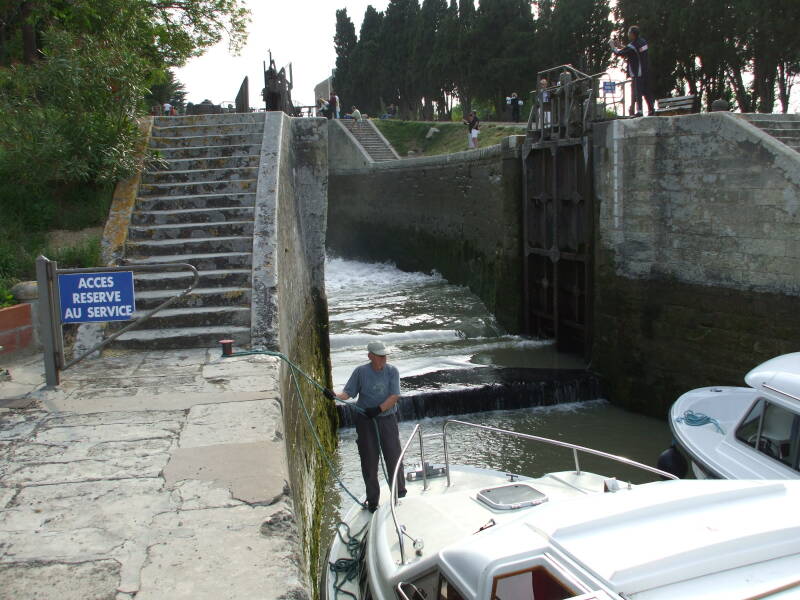 Boats passing through the 7-lock flight of Fonserannes on the Canal du Midi.