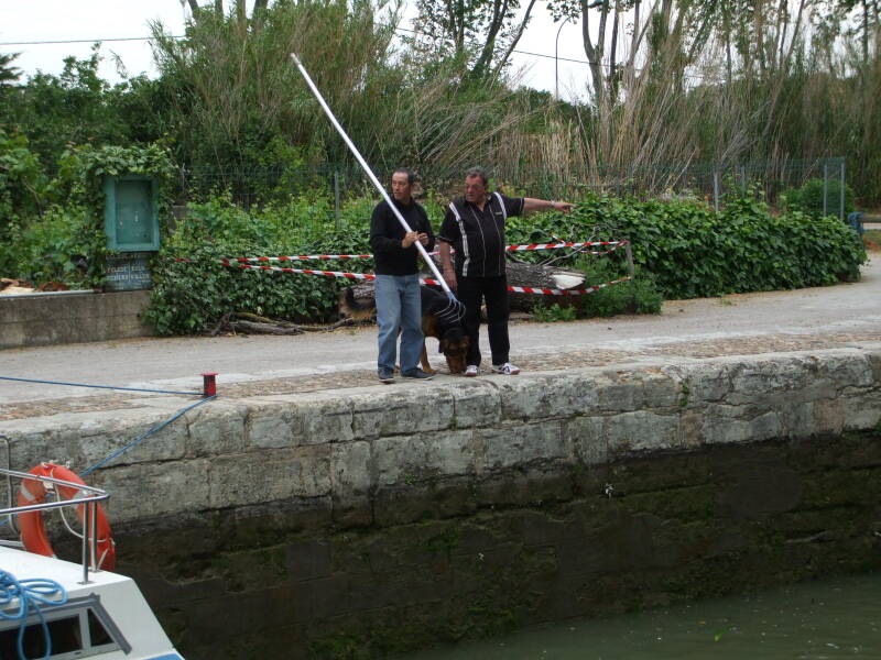 ALT: Passing through a lock on the the Canal du Midi in a rented boat.