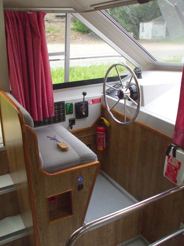 Interior helm on board a rented canal boat.