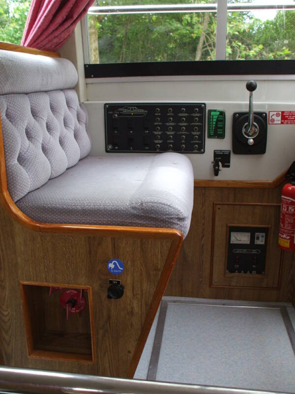 ALT: Interior helm on board a rented canal boat.