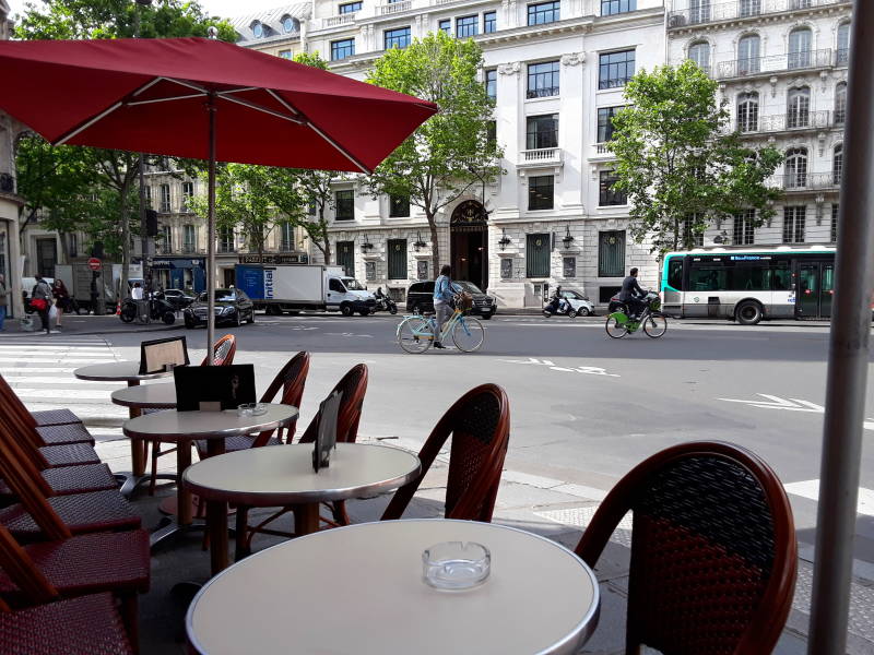 Cafe and croissant while sitting at Le Mistral bar-brasserie and tabac near Saint-Lazare in Paris.