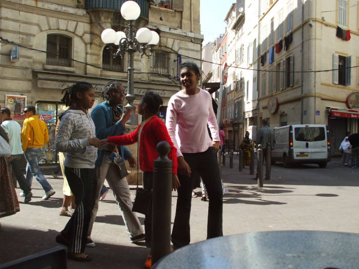 Watching the crowds pass while seated at le Grand Bar Vacon in the market district of Marseille.