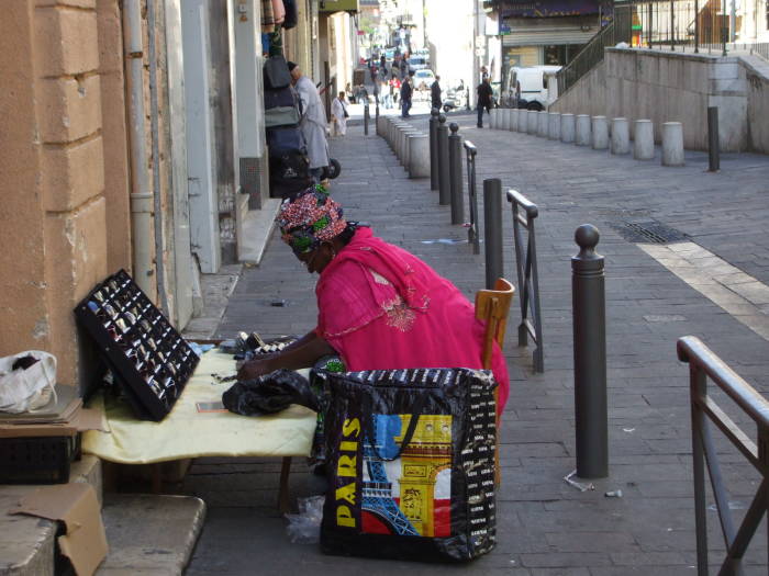 Street vendor along Rue des Petites Maries in Marseille.