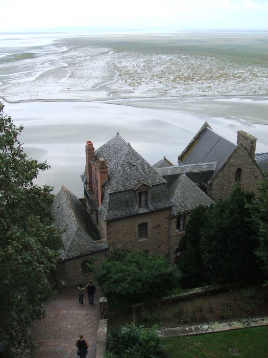 Tidal mud flats surround Mont Saint-Michel.
