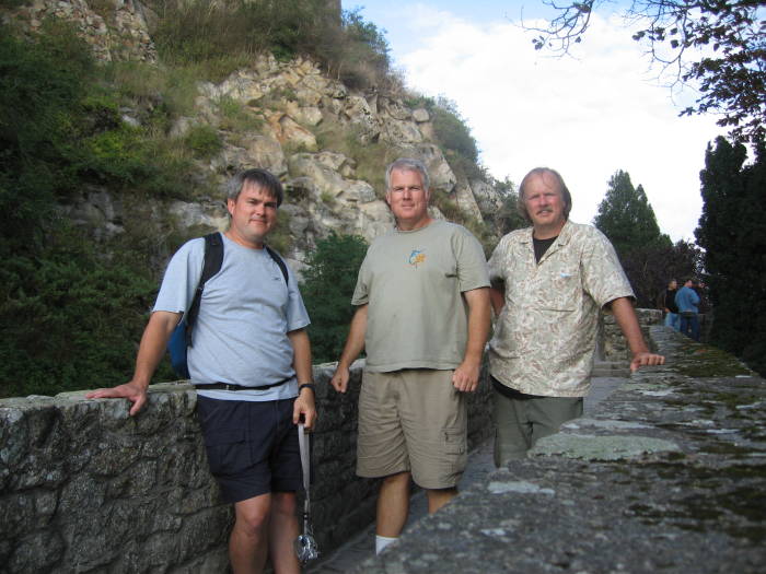 Three guys visiting Mont Saint-Michel.