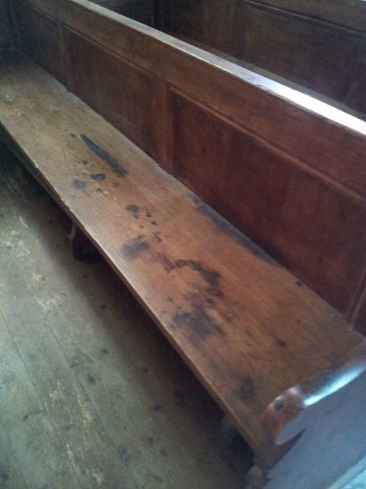 Blood stains on the pews of the church at Angoville au Plain.