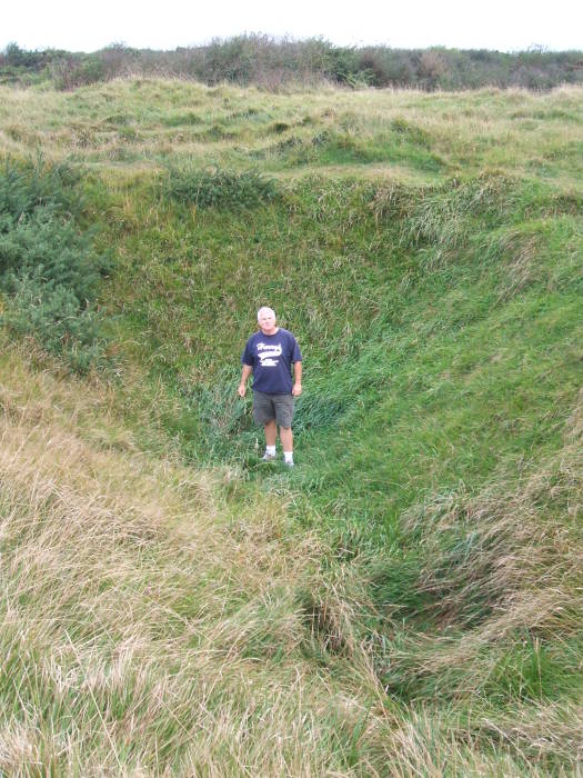 Large shell crater at Pointe du Hoc.