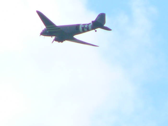 A C-47 drops paratroopers outside Sainte-Mère-Église.