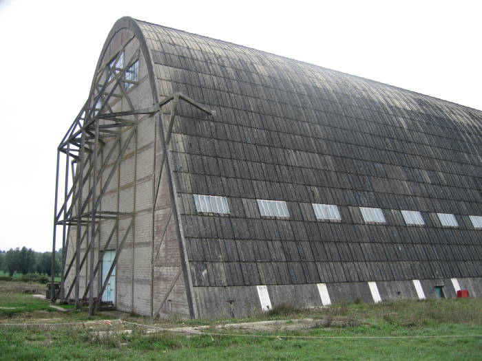 Exterior angled view of concrete balloon hanger in Normandy, inland of Utah Beach.