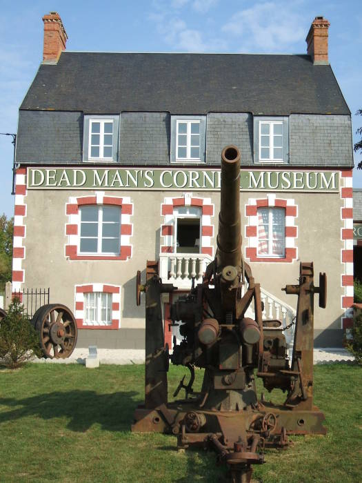 An old stone inn turned into a museum at Dead Man's Corner, in Normandy, near the D-Day landing sites at Utah Beach.  A rusting old German 88mm gun in the foreground.