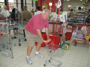 Jeff with a tiny shopping cart in a French supermarket.