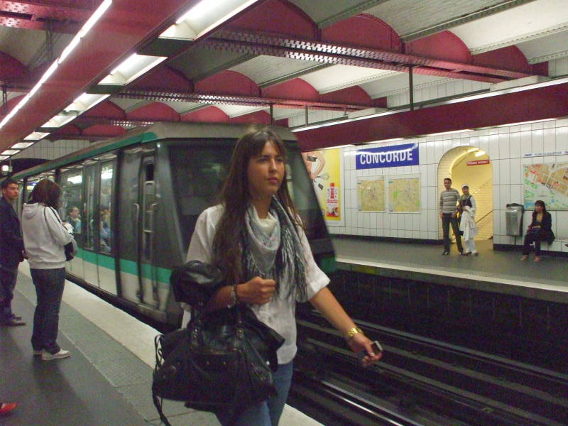 Paris Métro train arrives at a station.