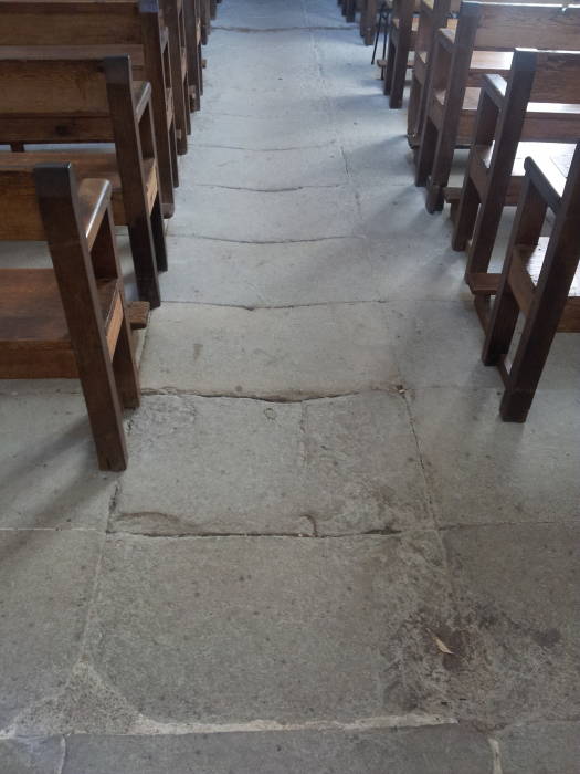 Worn floor in the nave of the Church of Saint Michael in Roussillon.