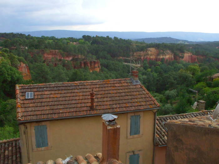 Ochre outcroppings around Roussillon, darker red and orange.