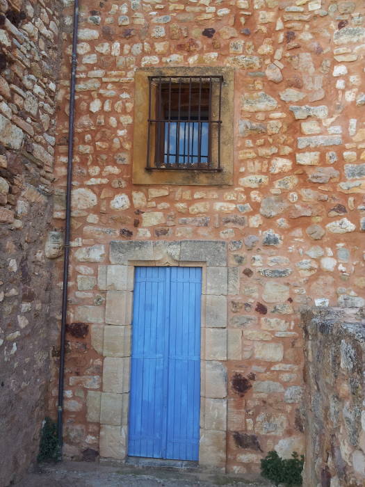 Bright blue door on an old building in Roussillon.