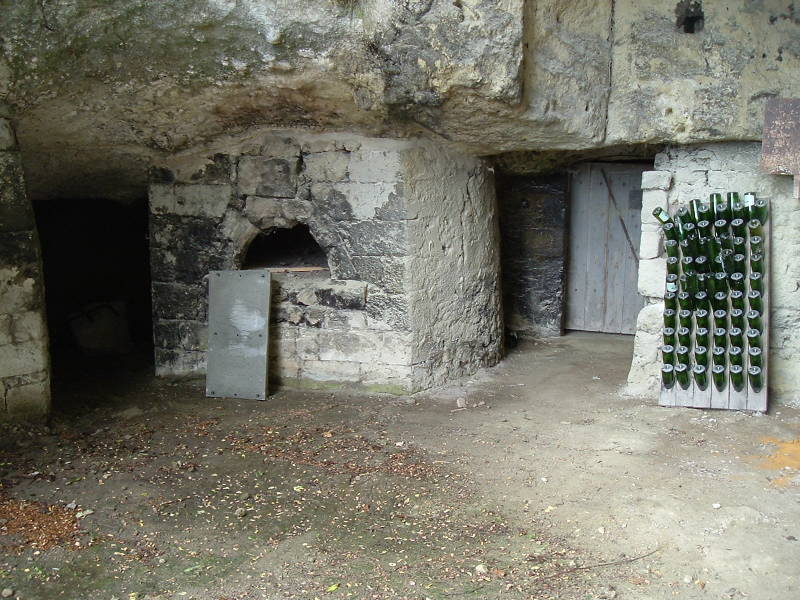 Wine cellars cut into the soft limestone bluffs along the Loire River near Saumur, France.