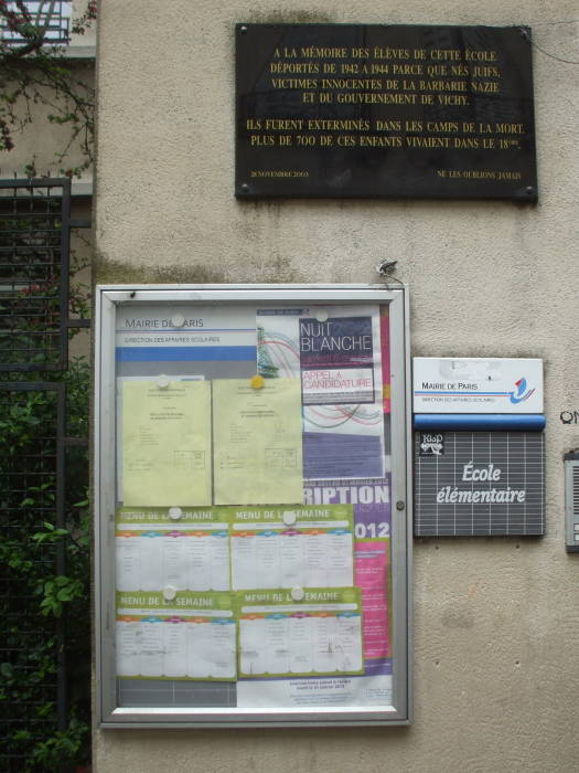 Message board at an elementary school in Paris, between Pigalle and Montmartre in the 18th Arrondissement.