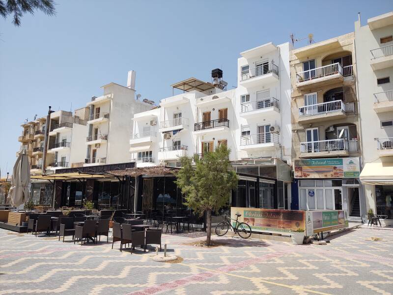 Shops and cafes under apartments at the waterfront in Ierapetra.