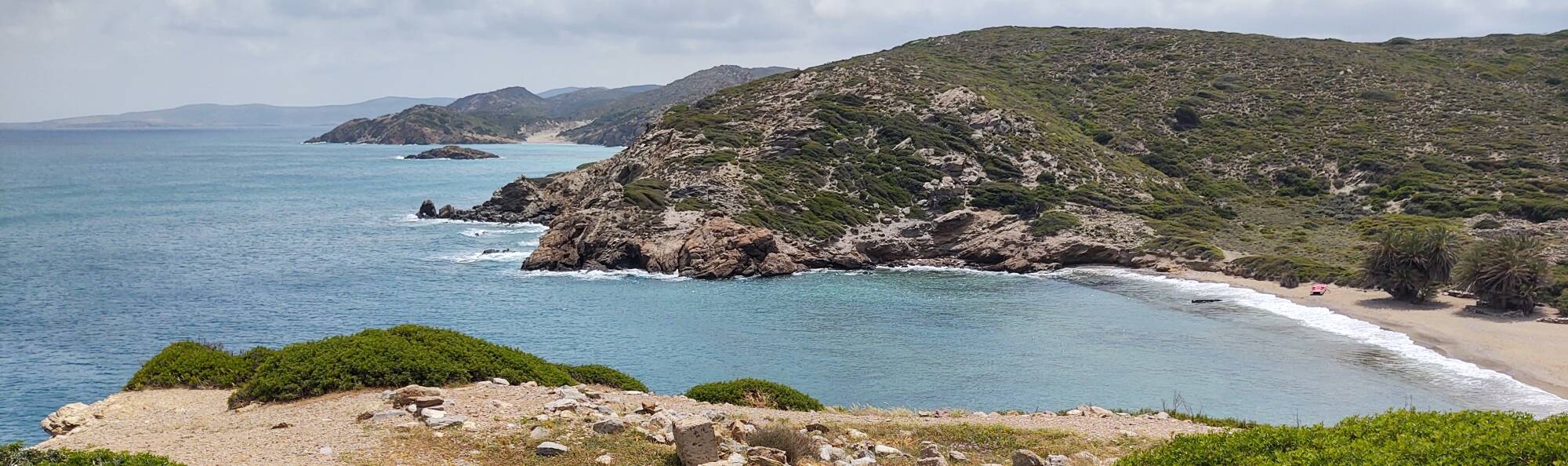 Basilica ruins, the beach, and distant coastline at Itanos at the eastern tip of Crete.