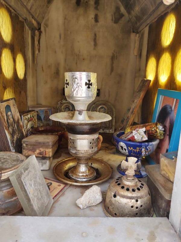 Interior of roadside shrine at the parking lot at Itanos.