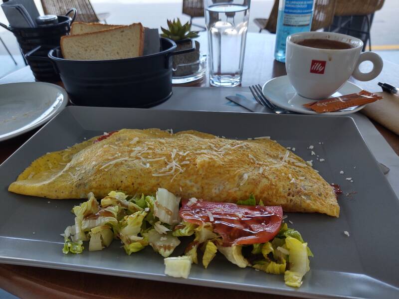 Omelette and coffee at the Sailing café along the waterfront in the port town on Ios.