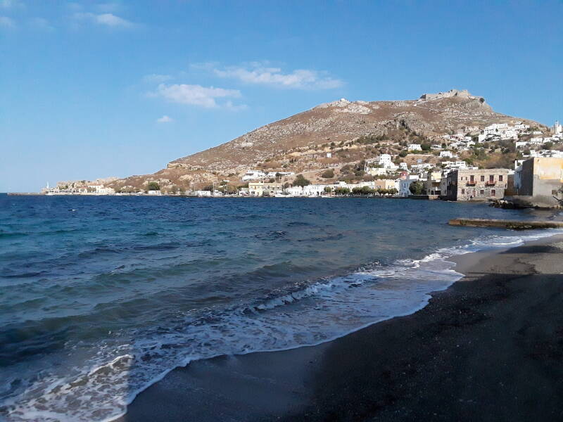 Beach, waterfront, and Pandeli Castle in Agia Marina.