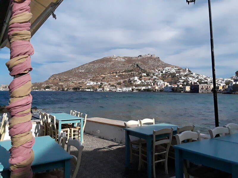 View of Agia Marina and Pandeli Castle at Mylos restaurant on the waterfront in Agia Marina.