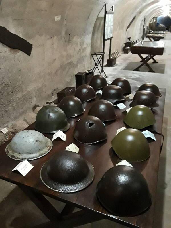 Table with military helmets in the Merikia War Museum.
