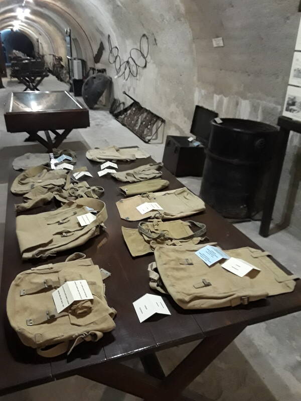 Table with military satchels and small bags in the Merikia War Museum.