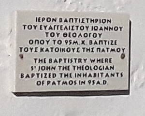 Plaque on the chapel replacing the one thought to have been where John the Theologian baptized the local people.