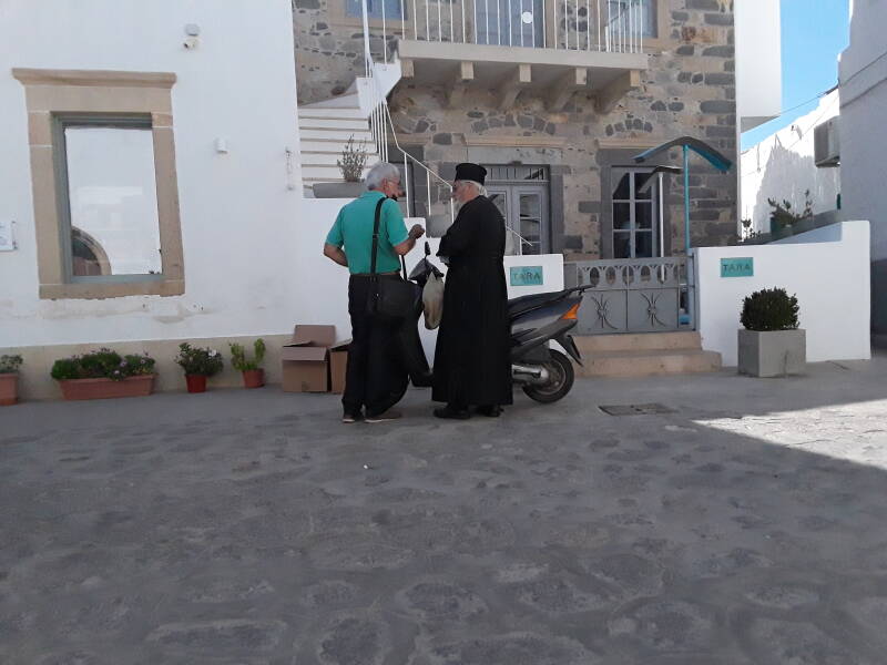 Priest with his scooter in Skala.