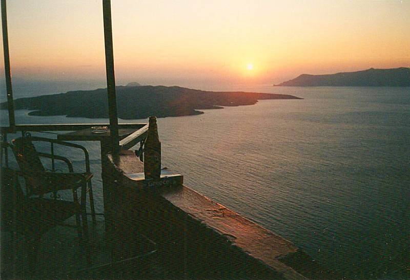 Sunset over Santorini as seen from a taverna.