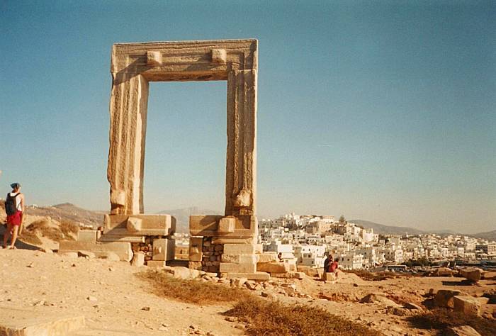 Naxos harbor seen through a monumental gateway.