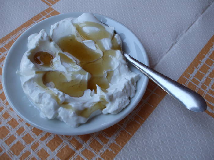 Greek dessert of yogurt and honey in a Greek taverna in Delphi.