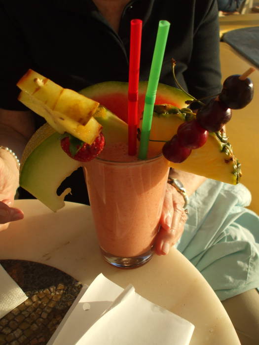 Fruit drink at a cafe along the waterfront in the Little Venice district on the Greek island of Mykonos.